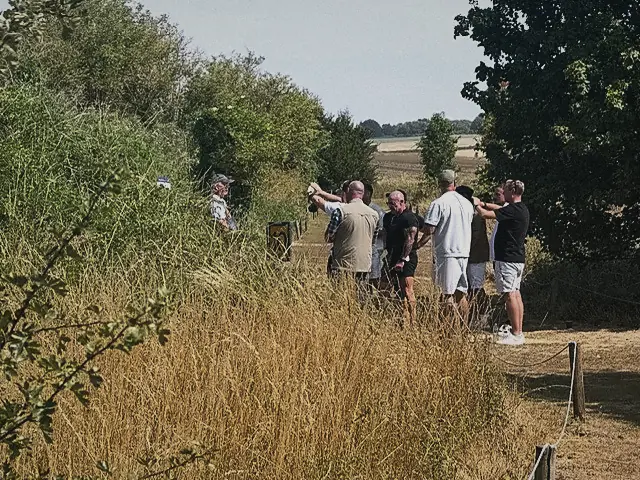 A group watching from the edge of the range