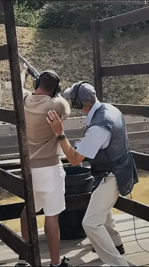 An instructor guiding a member's stance