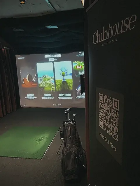 A simulator bay with Clubhouse and Mashie branding at Pitch
