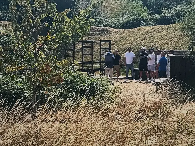 Members waiting their turn at the shooting stand