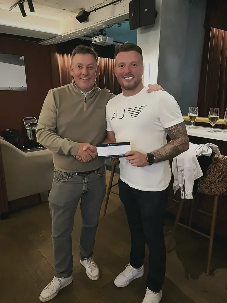 Two members with a competition prize